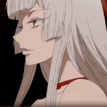 a woman with long white hair and yellow eyes
