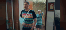a man with a broken arm wearing a shirt that says california