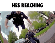 two police officers are jumping in the air with the words hes reaching above them .