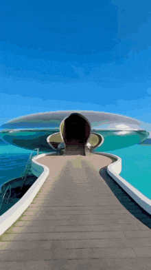 a building with a staircase leading up to it that looks like a spaceship