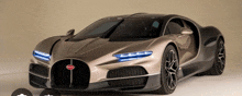 a bugatti car is displayed on a beige background