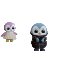 a couple of penguins hugging each other with a heart above them