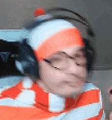 a blurry picture of a person wearing headphones