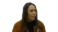 a woman with long hair is wearing a brown sweater and black turtleneck