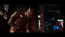 a blurry picture of a man in a superhero costume fighting another man