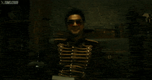 a man wearing red sunglasses and a military uniform with the year 2005 on the bottom of the screen
