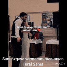 a bride and groom are dancing in front of a man with a heart in the background