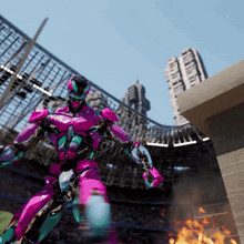 a pink and green robot is standing in a stadium with a fire in the background