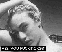 a black and white photo of a man with the words yes you fucking can
