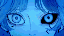 a close up of a person 's face with a blue background
