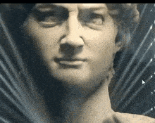 a close up of a statue of a man 's face with an arrow pointing to the right