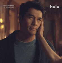 an advertisement for nine perfect strangers with a man smiling