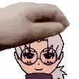 a hand is putting a cartoon character 's head on top of another person 's head .