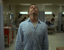 a blurry picture of a man kneeling down in a hospital