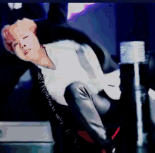 a man in a white shirt is laying on his back