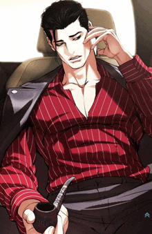 a man in a red shirt is holding a pipe