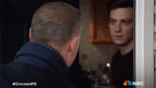 two men are looking at each other in a chicagopd scene
