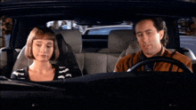 a man and a woman in a car with the words he was a very bad dictator on the screen
