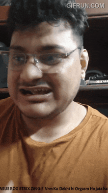 a man wearing glasses and a shirt that says asus rog strix z890 e vrm ka dekht hi orgasm ho jata hai