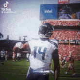 a football player with the number 14 on his shirt