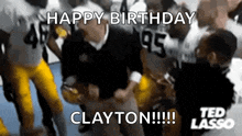 a group of football players are celebrating clayton 's birthday in a video .