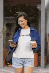 a woman wearing a white t-shirt that says appmart