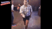 a man is dancing in a video that says dancing