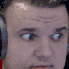a close up of a man 's face with his eyes closed