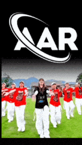 a group of people are dancing in front of a logo that says aar