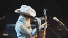 put on a guitar orville peck stagecoach start playing guitarist