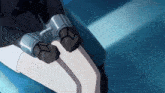 a person wearing a pair of handcuffs is sitting on a blue chair