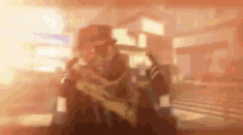 a blurry picture of a man in a hat holding a gun in a room .