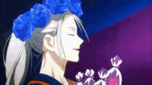 a woman with white hair and blue flowers in her hair is holding a bouquet of flowers .
