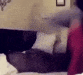 a blurry picture of a person laying on a bed