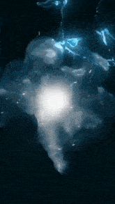 a light shines through the dark water