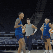 a basketball player wearing a blue jersey that says lnc