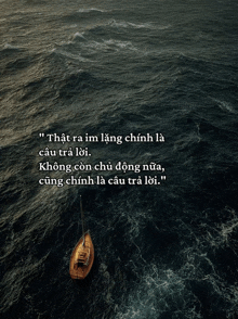 an aerial view of a boat in the middle of the ocean with a quote below it