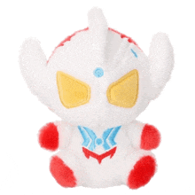 the back of a red and white stuffed animal with a blue toy