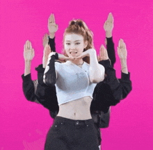 a woman wearing a white crop top with the number 13 on it