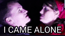 a man and a woman are looking at each other and the words i came alone are above them