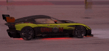 a green and black racing car with the word union on the side
