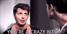 a man and a woman are talking to each other and the man is saying `` you 're a crazy bitch ''