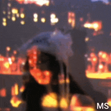 a blurry picture of a person with the letters ms on the bottom right