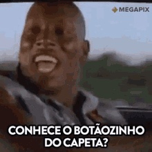 a man is laughing in a car with the words conhece o botaozinho do capeta written on the bottom .