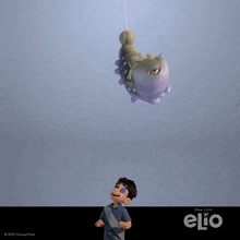 a poster for the movie elio shows a boy and a caterpillar