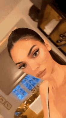 a close up of a woman taking a selfie in a bathroom .