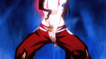 a woman in red pants is holding a sword in her right hand