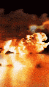 a blurred image of a statue of a lion in flames