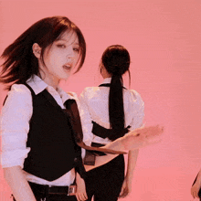 a woman in a white shirt has a prada belt on her waist