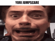 a close up of a man 's face with the words yuri jumpscare written on it